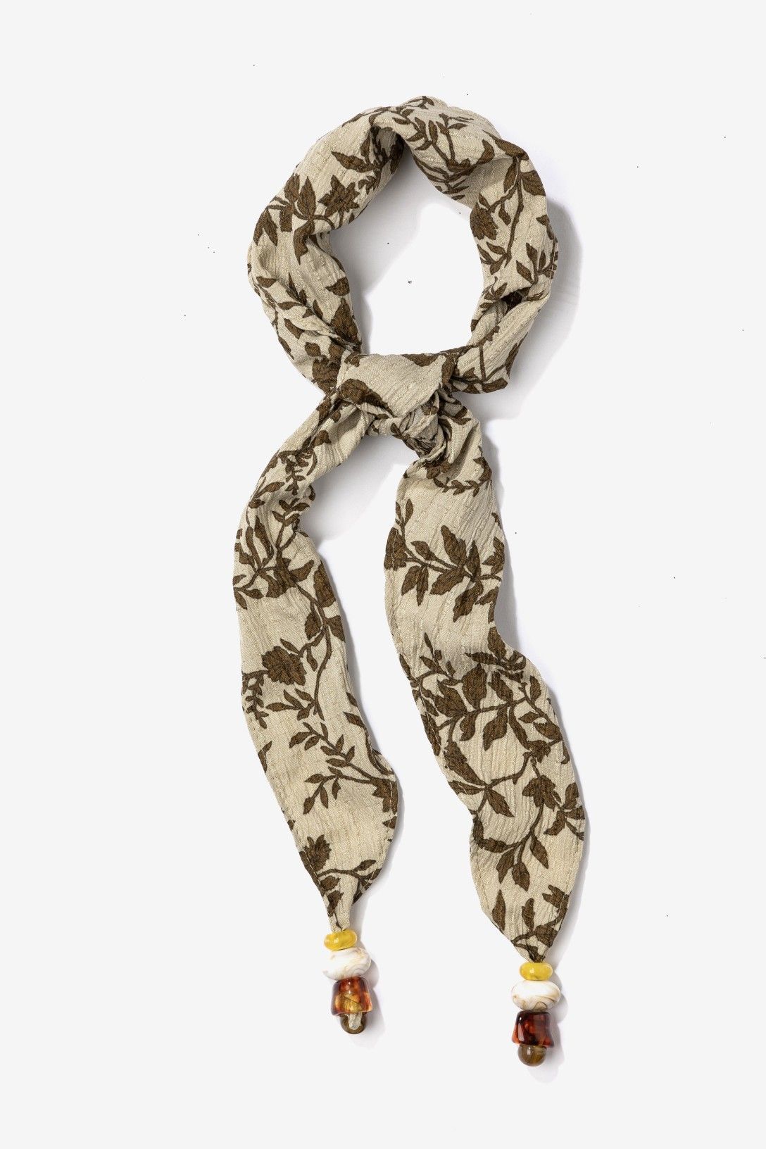 Bandana Estampada Hojas Vilanova beige con detalles decorativos